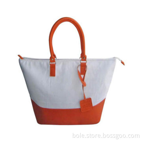 PVC handbag with fashion design, nice handle and #5 nylon zipper and silver handware